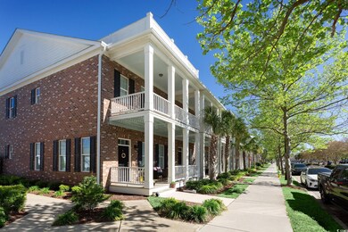 View of side of home with a balcony and a porch