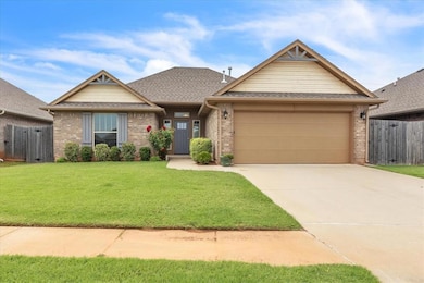 View of front of home with brick siding, an attached garage, concrete driveway, and roof with shingles