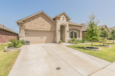 View of front facade featuring a garage and a fron
