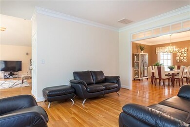 Living/sitting/library room ...opens to Dining room with door to rear covered deck. An excellent setup for entertaining!