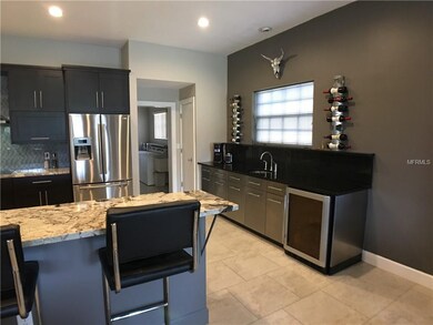 Extra counter space in kitchen with sink and bever