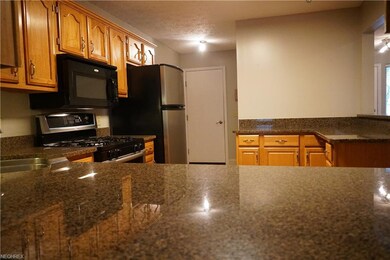 Stainless/black appliance, granite counters with a