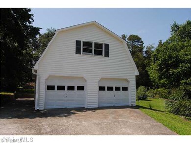 Parking Lot/Garage. Close up view of detached garage.  Parking for 4 no problem here  Home offers 2 car attached plus this for 2 more cars.
