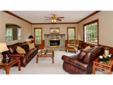Cozy family room with wood burning fireplace.