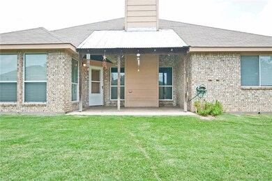 Covered back patio is perfect for those hot summer