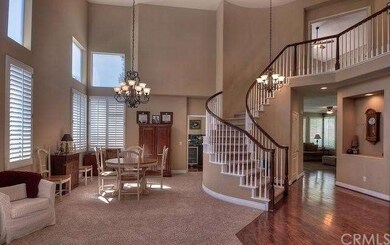Elegant Living Room boasts a beautiful curved stai