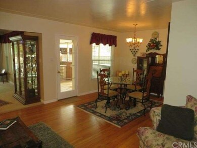 View from living room to dining on right and famil