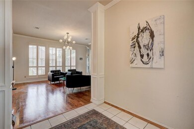 Living area, wood flooring, wall of windows with p