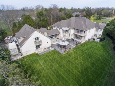 This home provides abundant outdoor living areas with multiple balconies, patios, gazebo, and sitting areas.  The party can spill over into the beautifully manicured lawn!