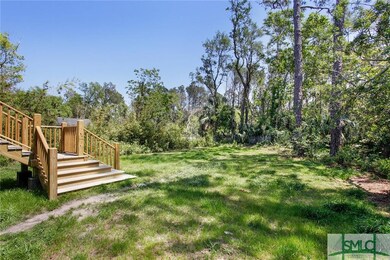 YARD BORDERS ON A WOODED NATURE AREA AND BIRD HABI