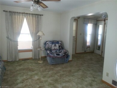 Foyer area adjacent to the living room with ceilin