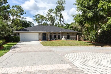 Large, ornate brick driveway with ample parking