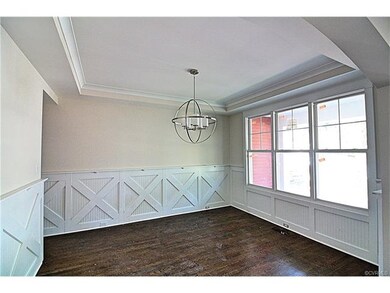 The dining room has some great custom trim and tre