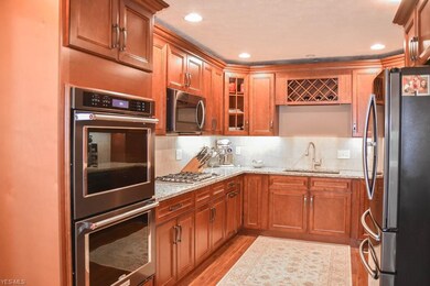 The kitchen has granite counters and a built-in wi