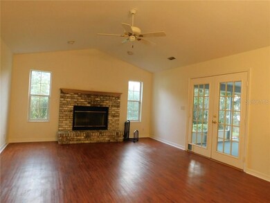 Cathedral Ceiling & woodburning fireplace in famil