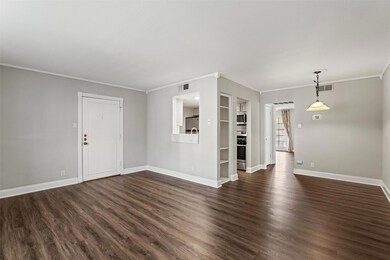 Unfurnished living room featuring dark wood-style