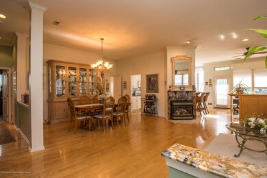 Gleaming hardwood floors welcome you in.