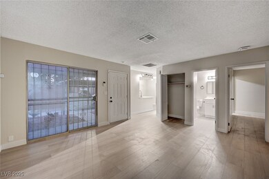 Unfurnished room featuring baseboards, visible ven