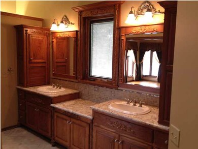 The master bath area has radiant-heated floors and