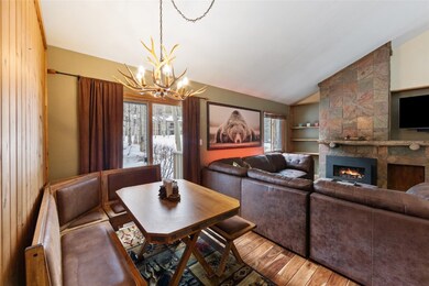 Dining area with natural light, vaulted ceiling, a