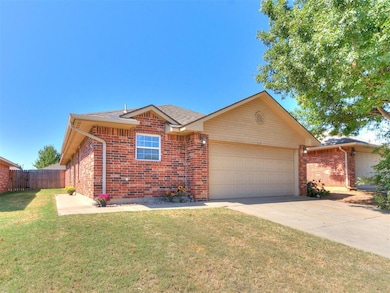 Ranch-style home with a garage and a front yard