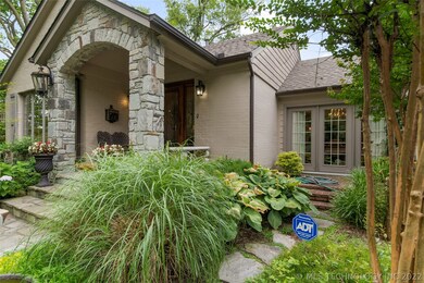 House is a combo of brick and stacked stone.