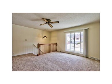 Living Room. OPEN FOYER WITH OAK RAILINGS AND STAI