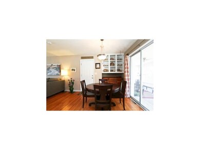 Dining area open to living room and kitchen.