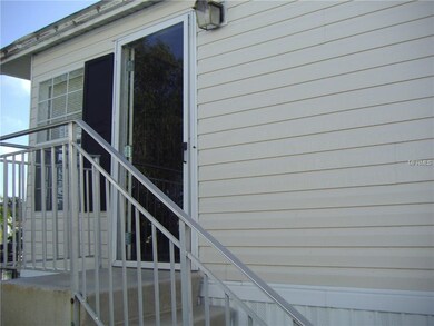 The fron door id on the side of this Home and lead