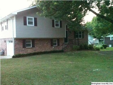 Front with large shade tree