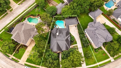 An aerial view of the home and pool, showing you t