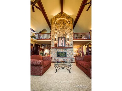 GREAT ROOM,  SPECTACULAR STONE FIREPLACE WITH BEAU