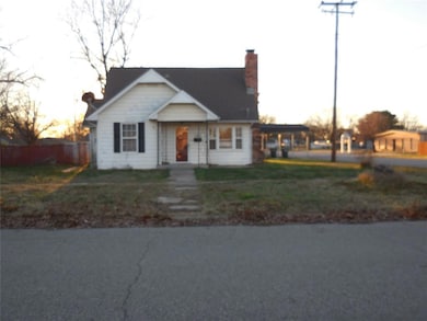 View of front of house featuring a carport and a l