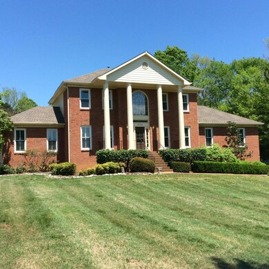 A very well manicured lawn welcomes you home to a true 