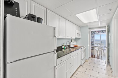 Kitchen featuring sink, light tile patterned floor