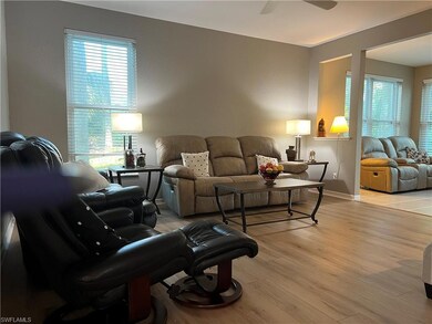 Sitting room with light tile patterned flooring an