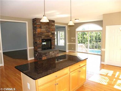 Kitchen - hardwood floors, granite island with sto