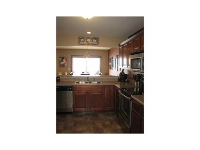 Kitchen. Kitchen is open to the breakfast bar and 