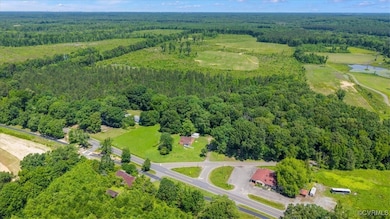 Drone / aerial view of a heavily wooded area and a