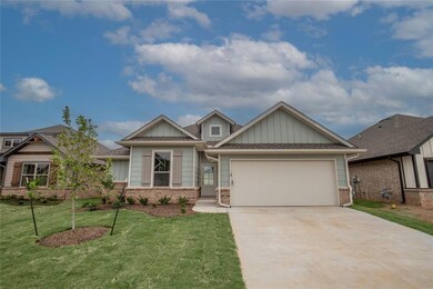 Craftsman-style house with a garage and a front yard