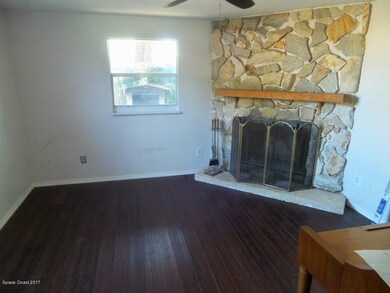 Den with Wood Fireplace and Piano!