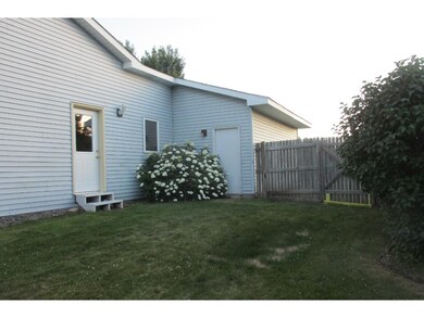 Back yard is nicely landscaped and fenced.