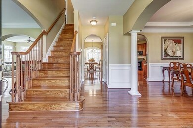 Beautiful hardwood floors can be seen throughout t