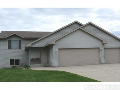 Front view.  Nice three stall garage.