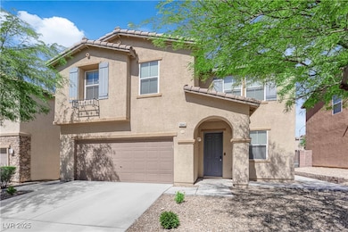 View of front of home with stucco siding, a tile r