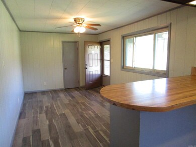 Front door opens into Dining/Kitchen Area