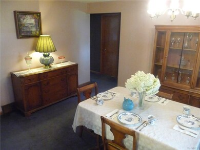 Formal dining flows to hall with bedrooms.