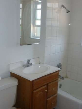 Front House bedroom facing street. 2 sets of windo