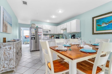 DINING AREA, KITCHEN AND 2ND BEDROOM