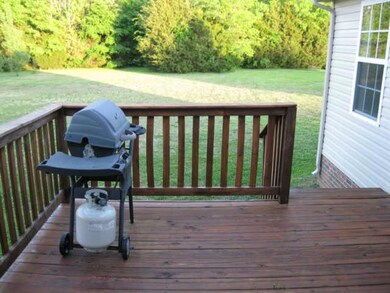 ENJOY YOUR PRIVACY, ENTERTAINING FRIENDS ON THIS QUIET BACK DECK.